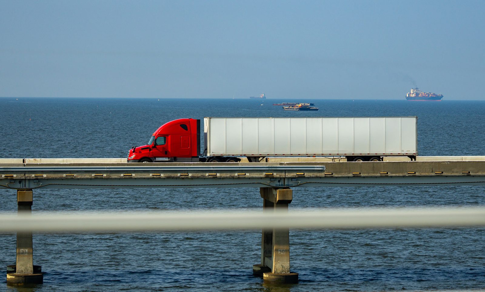 Tractor-trailer crossing a bridge
